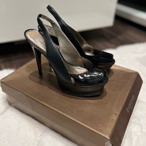 Bebe black patent leather sling back platform pumps in a size 7M.